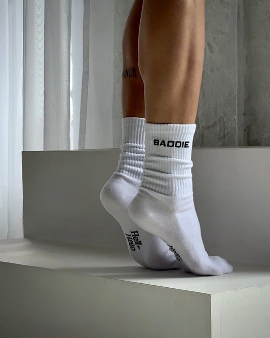 White socks with 'BAODIE' branding worn by a person on a neutral background